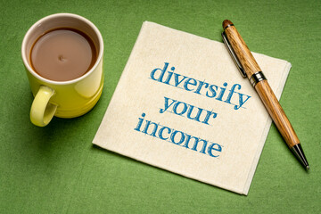 Wall Mural - diversify your income note - writing on a napkin with a cup of coffee. business and financial concept