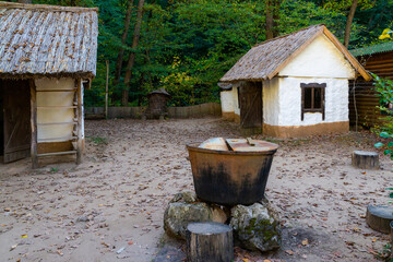 Traditional white slavic house with a thatched roof