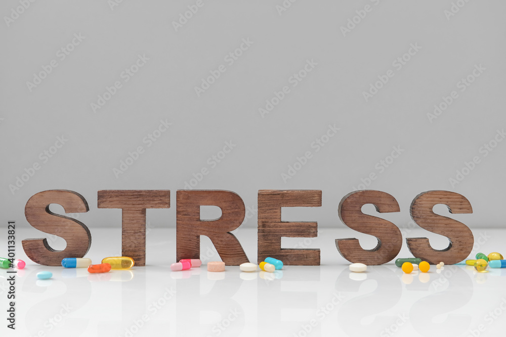 Composition with word STRESS on light background