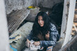 © panitan - poor people,homeless or beggar begging for help sitting at dirty slum.concept for poverty hunger,human rights,donate and charity for underprivileged children in third world