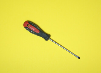 screwdriver on a yellow background