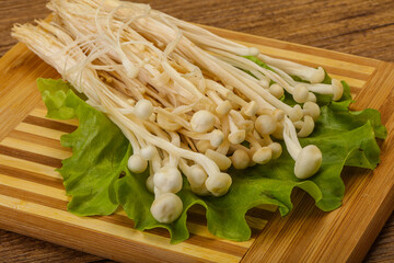 Raw Enoki mushrooms for cooking