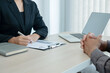 © Orathai - Business people hold a resume and talk to job applicants for job interviews about careers and Her personal history in the company. Recruitment concepts