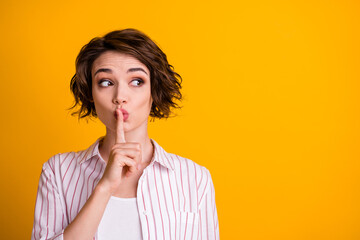 Poster - Photo of surprised girl look copyspace confidential information put index finger lips keep quiet wear striped shirt isolated over bright shine color background