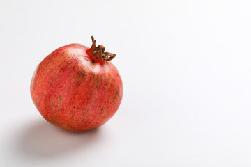 Fresh pomegranate fruit on white background