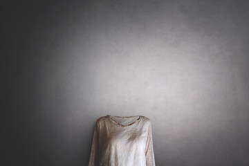 invisible woman with no face wearing a blouse, concept of losing identity