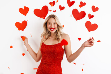 Happy beautiful girl in red dress laughing and looking at camera