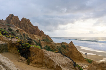 Poster - large sand dunes and broken up beach access road severely affected by wind and water erosion on the coast