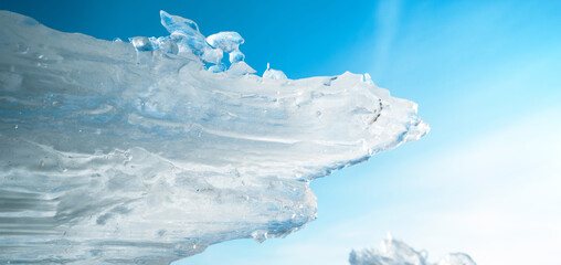 Ice on the snowy surface of an icy river, winter background