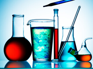 Sticker - Different laboratory glassware with color liquid and with reflection