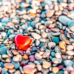 Poster - Romantic symbol of red heart on the pebble beach