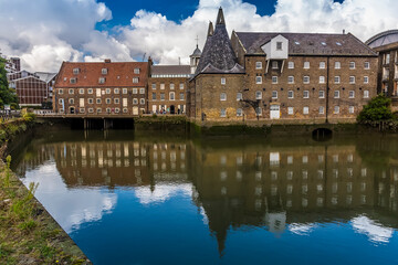 Sticker - Eighteen-century mills reflected in the still waters of the River Lee in Lee Valley, London in the summertime