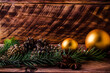 cones and branches on wooden boards with a large Christmas ball.