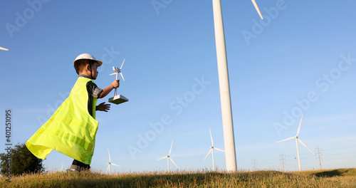 Asian little boy wants to be an engineer the wind turbines, Child\'s dream of environmental engineering renewable energy concept