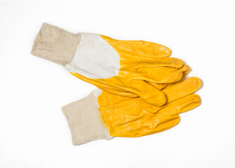 construction protective gloves in yellow on a white background