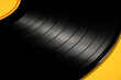 © Tetra Images/Tetra Images - Vintage record on yellow background