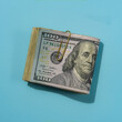 © Tetra Images/Tetra Images - Wad of US dollar bills