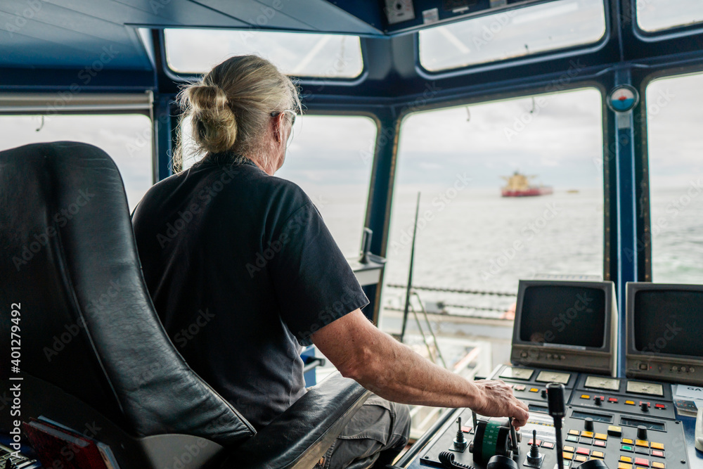 Captain of deck Officer on bridge of vessel or ship during navigaton ...