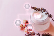 © Miha Creative - Cosmetic cream bottle with ingredients and flowers with digital vitamin icons. Q10 and vitamins.