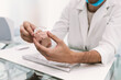 © Dani Navarro/ADDICTIVE STOCK - Dentist teaching the Discharge Splint