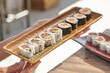 © Philippe Degroote/ADDICTIVE STOCK - High angle of sets of assorted sushi rolls served on table in Asian restaurant
