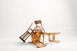 © Txema Gerardo/ADDICTIVE STOCK - Set of old chairs stacked against white background