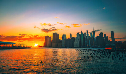 sunrise over the city skyline New York buildings sun Sumer 