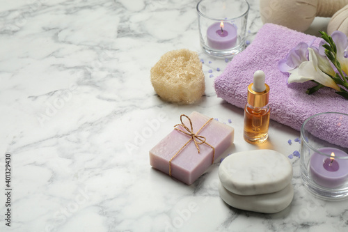 Fotografering Spa composition with skin care products on white marble table, space for text