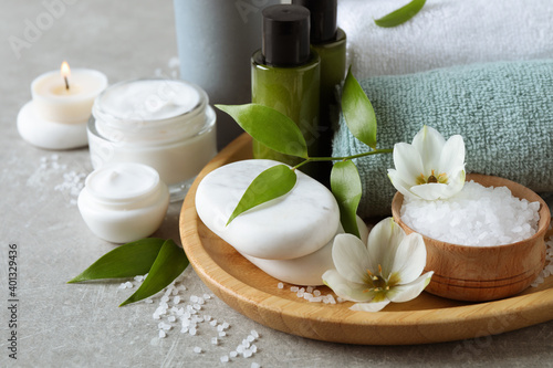 Fotografering Spa composition with skin care products on textured table, closeup