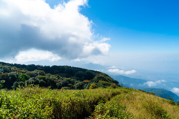 beautiful mountain layer with clouds and blue sky