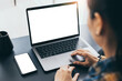 © panitan - computer screen,cell phone blank mockup.hand woman work using laptop texting mobile.with white background for advertising,contact business search information on desk in cafe.marketing,design