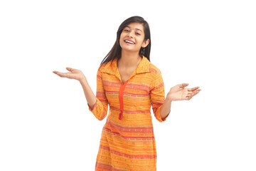 Wall Mural - Attractive cheerful young women greetings against white background.