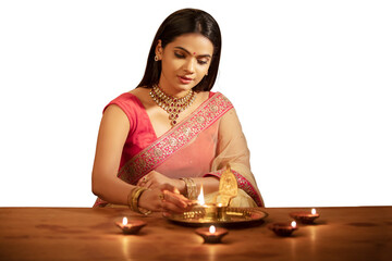 Poster - Beautiful Hindu Indian young women lightening Diya on Diwali day on white