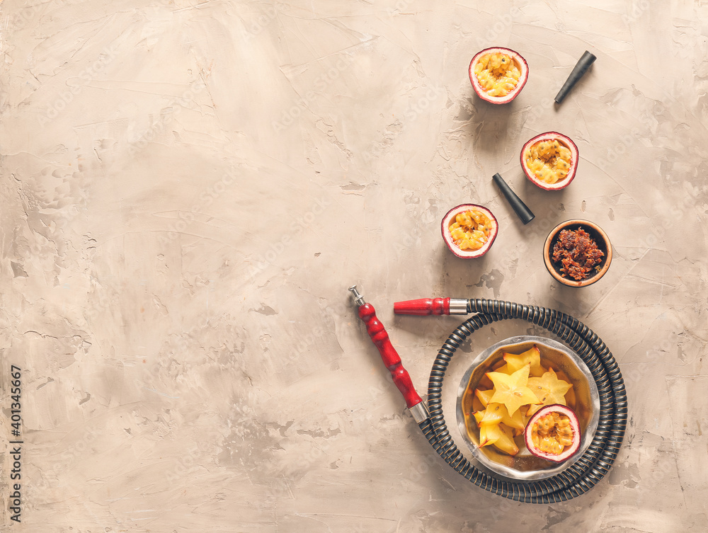 Parts of hookah and fruits on table
