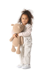 Poster - Cute African-American baby girl with teddy bear on white background