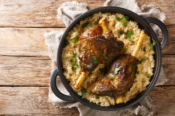 Haneeth is a traditional Yemeni dish also trendy in the rest of the Arabian Peninsula closeup on the table. horizontal top view from above