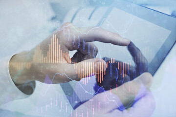 Multi exposure of man's hands holding and using a phone and financial chart drawing. Market analysis concept.