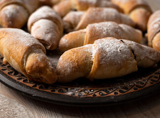 Sweet rolls filled with jam on the kitchen table