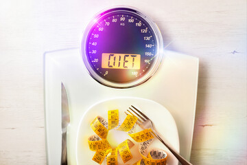 Diet concept with scale with message and plate with tape