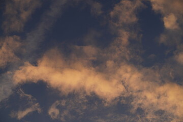 deep blue sky with bright orange clouds