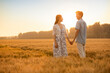 © Blue Jean Images - Happy young couple having fun in wheat field