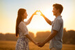 © Blue Jean Images - Happy young couple having fun in wheat field