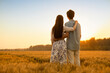 © Blue Jean Images - Happy young couple having fun in wheat field