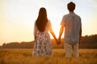 © Blue Jean Images - Happy young couple having fun in wheat field