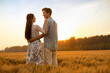 © Blue Jean Images - Happy young couple having fun in wheat field