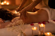 © Blue Jean Images - Young woman receiving back massage at spa center