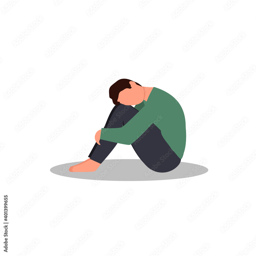 A lonely man sitting and hugging his knees. Young depressed male ...
