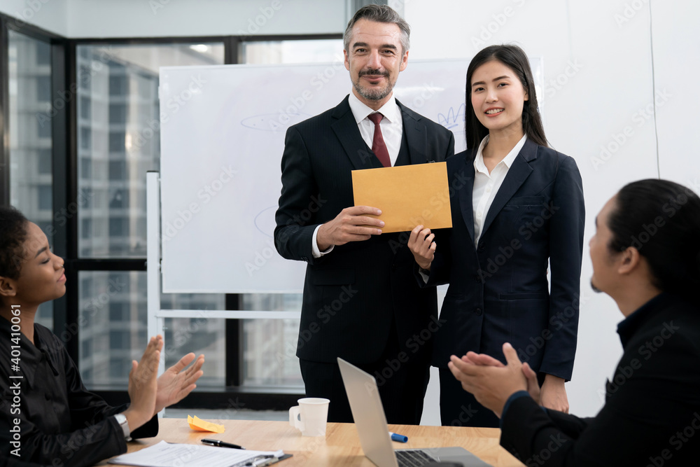 Business executives congratulate employees on their excellent work ...