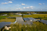 Fototapeta Mapy - Greenhouses in Lochristi, Belgium; aerial view