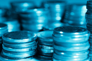 Wall Mural - rows of coins and blurred bokeh for finance and banking concept